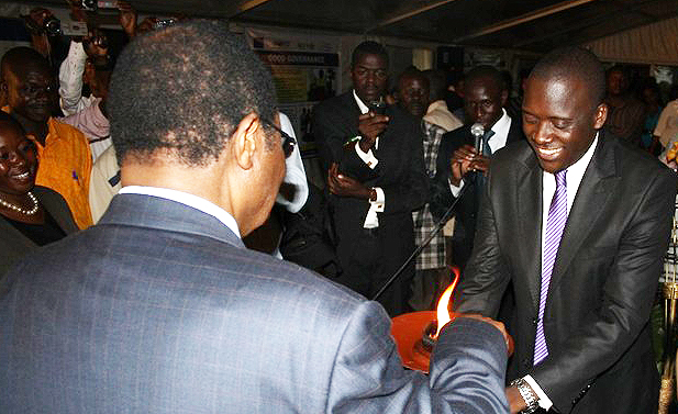 Chief Justice Benjamin Odoki lighting the Democracy Torch