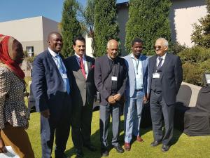 Justice (Rtd) Yacoob (M) chatting with some of the participants including Mr. Banda (second left) president, SADC LA