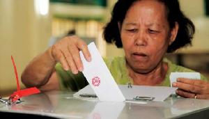 Woman casting vote 2013