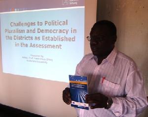 Assoc. Prof. Yasin Olum speaking at the dialogue in Mbarara, Pelican Hotel