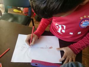 Child drawing. (c)Yahad - In Unum