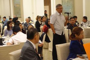 Participant during Open Forum delivering his question to the stage