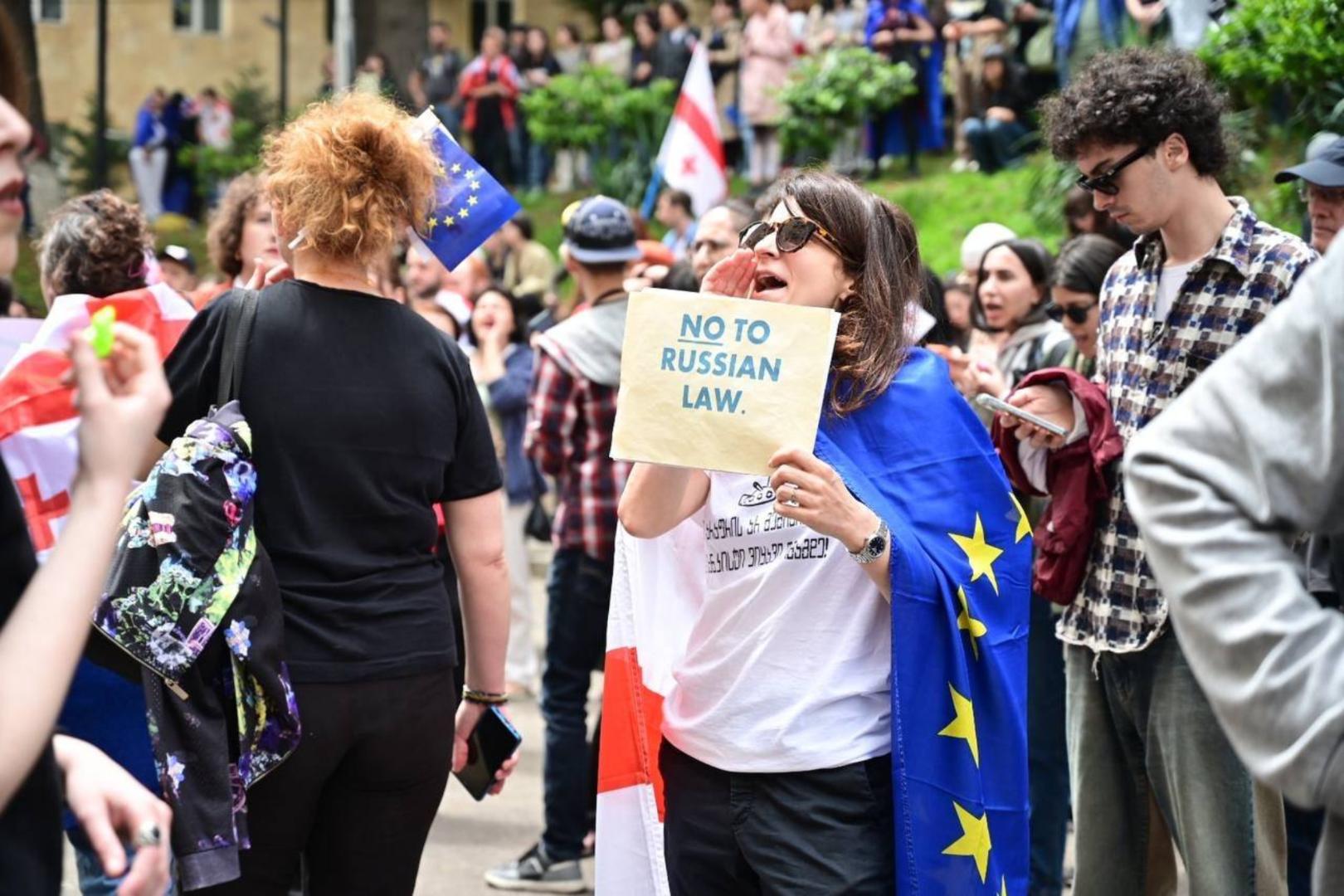 Demonstrators attend a rally to protest against a bill on foreign agents , after Georgia s parliament voted to override a presidential veto of the bill, in Tbilisi, Georgia.