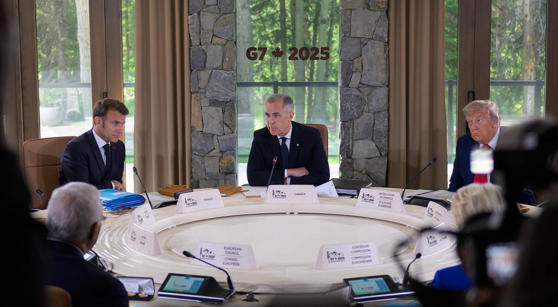 From left: French President Emmanuel Macron, Canadian Prime Minister Mark Carney, and U.S. President Donald Trump, take part in a working session at the G7 Summit in Kananaskis, Alberta, Canada, on Monday, June 16, 2025.