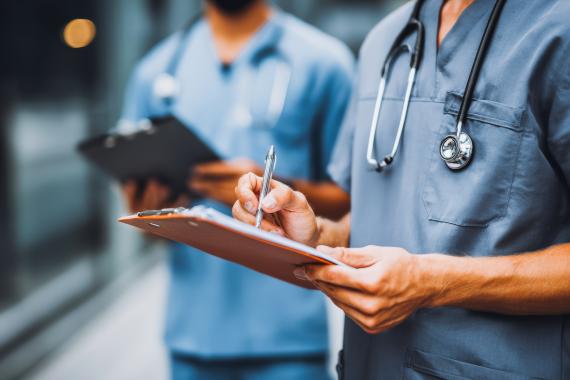 Medical professionals review patient files