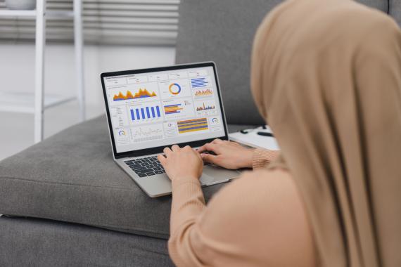 A Woman Analysing Sales Performance Charts