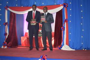 Chief Justice Maraga and Mr. Peter Wendoh displaying the publication after the launch
