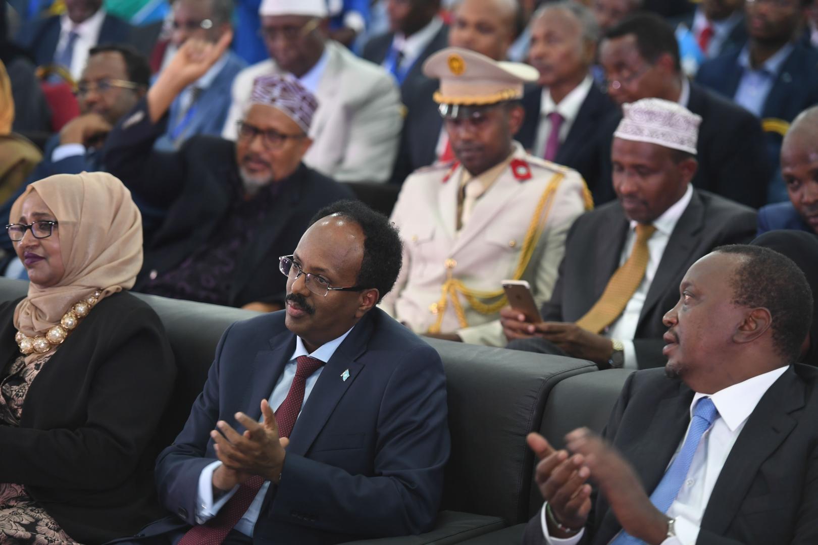The President of Kenya, Uhuru Kenyatta (right), the President of Somalia Mohamed Abdullahi Farmajo (center( and other guests at the inauguration ceremony of President Farmajo in Mogadishu on February 22, 2017